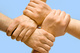 Image of crossed hands isolated over blue backgrou